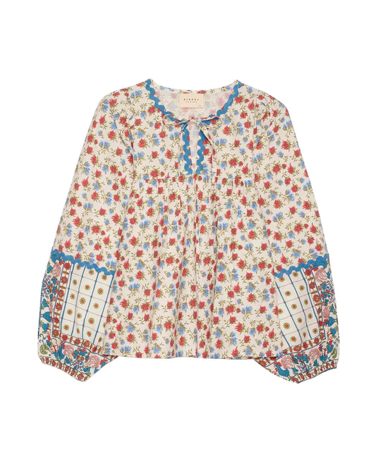 Floral blouse with blue accents on a black background