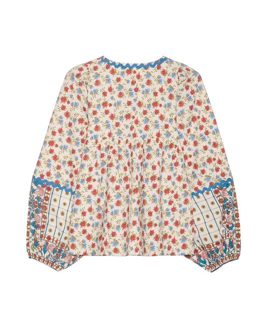 Floral patterned blouse on a black background