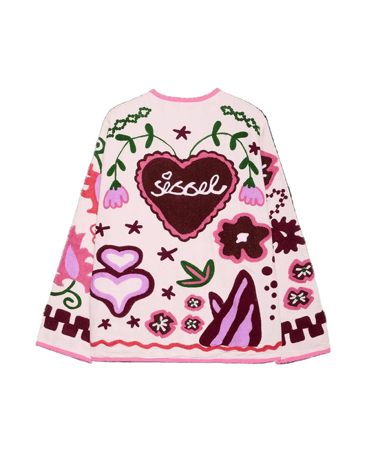 Decorative sweater with heart designs and floral patterns on a black background